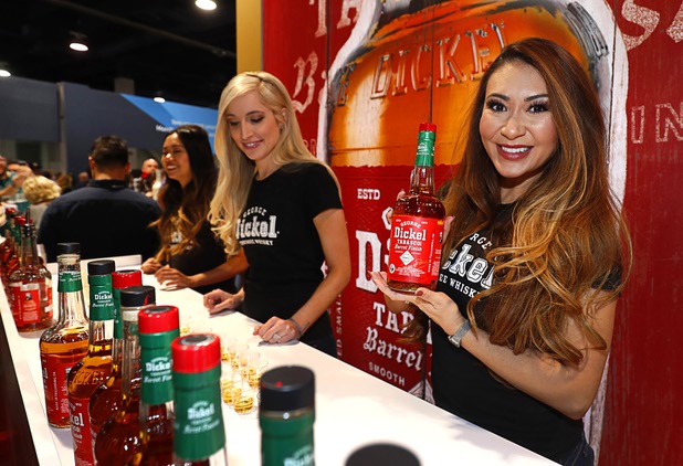 Sarah Laughter displays a bottle of George Dickel Tabasco Barrel Finish whiskey during the annual Nightclub and Bar Show at the Las Vegas Convention Center Tuesday, March 27, 2018.