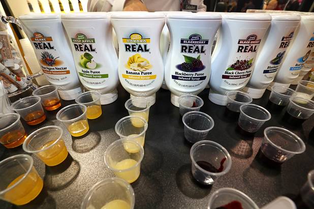 Infused syrups for cocktails are displayed at the American Beverage Marketers booth during the annual Nightclub and Bar Show at the Las Vegas Convention Center Tuesday, March 27, 2018. The company introduced banana and blackberry this year for a total of 16 flavors, a representative said.
