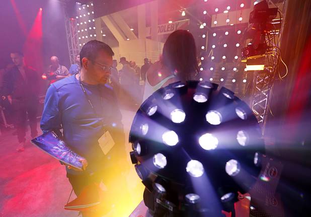 People check out products at the Limelite Pro Audio & Dj Supply booth during the annual Nightclub and Bar Show at the Las Vegas Convention Center Tuesday, March 27, 2018. The local company, 4601 W Sahara Ave., provides audio, video, lighting and DJ supplies.