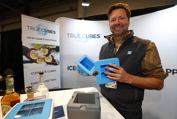 John Baumbach, president of True Cubes, displays the special tray used to make nearly invisible ice cubes. during the annual Nightclub and Bar Show at the Las Vegas Convention Center Tuesday, March 27, 2018. The two-level tray transfers the dissolved solids in the water to a lower level, leaving the cubes on top perfectly clear, he said. 