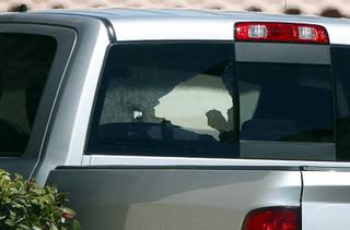 Damage to a pickup truck rear window is shown after a shooting at a Terrible Herbst at Sunset Road and Annie Oakley Drive in Henderson Friday, March 30, 2018.