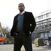 Architect Jonathan Garland poses for a photo on the construction site of a building he helped design in the Mattapan neighborhood of Boston on Tuesday, March 27, 2018. Garland is part of another minority -- black workers in U.S. metro areas in lucrative fields. An Associated Press analysis of government data has found that black workers are chronically underrepresented as compared with whites in high-salary jobs in technology, business, life sciences, and architecture and engineering, among other fields. 