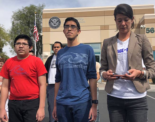 Ricardo Avalar-Gomez and Eric Avalar-Gomez speak to the media on Thursday, April 5, 2018, about the deportation of their mother, Cecilia Gomez. Bliss Requa-Trautz, director of the Las Vegas Worker Center, appears at right. Gomez was detained at a U.S. Citizenship and Immigration Services office during an appointment to receive permanent residency.