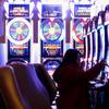 This Jan. 31, 2018, photo shows a gambler playing a slot machine at the Tropicana Casino and resort in Atlantic City N.J.