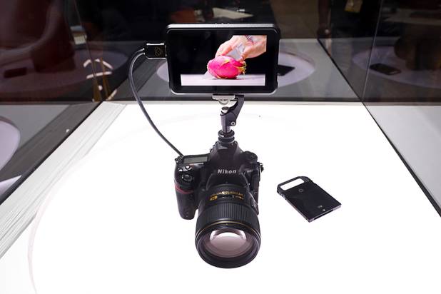 An Atomos Ninja V monitor/recorder is shown on a Nikon camera during the National Association of Broadcasters (NAB) show at the Las Vegas Convention Center Tuesday, April 10, 2018. The new monitor/recorder is smaller and lighter than previous models and records on a SSD drive.