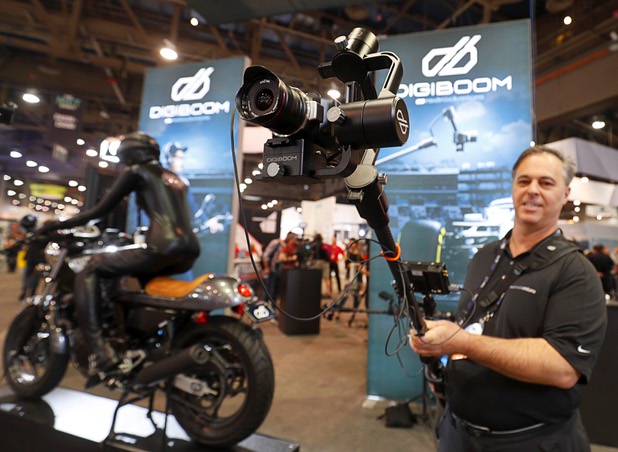 Brian Valente of Redrock Micro demonstrates the DigiBoom, a gimbal-stabilized, hybrid camera rig, during the National Association of Broadcasters (NAB) show at the Las Vegas Convention Center Tuesday, April 10, 2018. The DigiBoom is like a compact, mobile jib, he said.