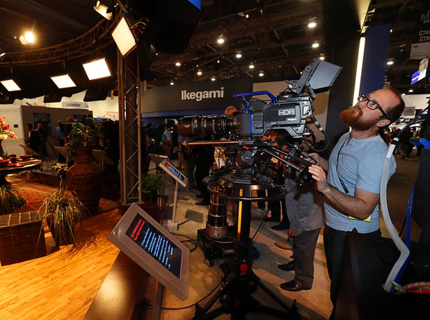 Videographer Travis Klecka tries out an 8K Ikegami video camera during the National Association of Broadcasters (NAB) show at the Las Vegas Convention Center Tuesday, April 10, 2018. The convention runs through April 12 and is expected to draw more than 100,000 attendees from 160 countries.