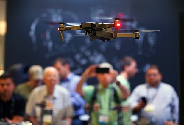 A DJI Mavic Pro Platinum drone flies during the National Association of Broadcasters (NAB) show at the Las Vegas Convention Center Tuesday, April 10, 2018. The drone flies farther and can stay aloft longer than previous models.