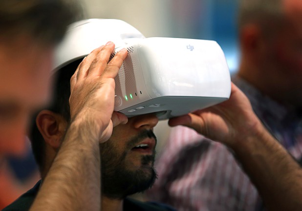 Sayed Massy controls a drone's camera using wireless DJI goggles during the National Association of Broadcasters (NAB) show at the Las Vegas Convention Center Tuesday, April 10, 2018.