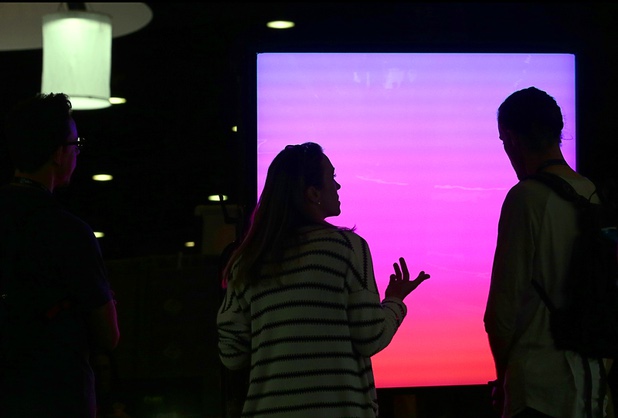 A couple looks over an NBC Universal LightBlade LB1K during the National Association of Broadcasters (NAB) show at the Las Vegas Convention Center Tuesday, April 10, 2018.