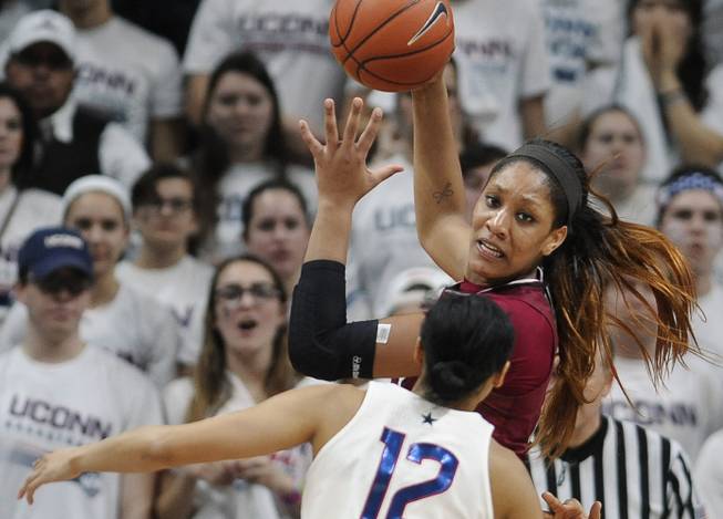 In this Feb. 13, 2017, file photo, South Carolina's A'ja Wilson, top, is guarded by Connecticut's Saniya Chong (12) in the second half of an NCAA college basketball game in Storrs, Conn.
