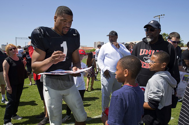 Quarterback Armani Rogers signs autographs during the UNLV Rebels Spring ...