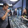 Alyssa Justino helps Michael Brousseau as he shops at Exhale Nevada dispensary during a dispensary bus tour sponsored by the Las Vegas Medical Marijuana Association Friday, April 20, 2018.