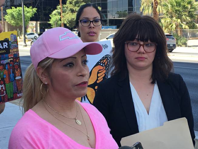 Cecilia Gomez, left, stands with her attorney Laura Barrera at a news conference in front of a U.S. Immigration Customs and Enforcement office in Las Vegas on Thursday, April 26, 2018.