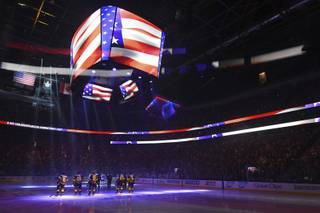 The Vegas Golden Knights and San Jose Sharks stand for the national anthem before Game 5 of their NHL hockey second-round playoff game Friday, May 4, 2018, at T-Mobile Arena in Las Vegas.