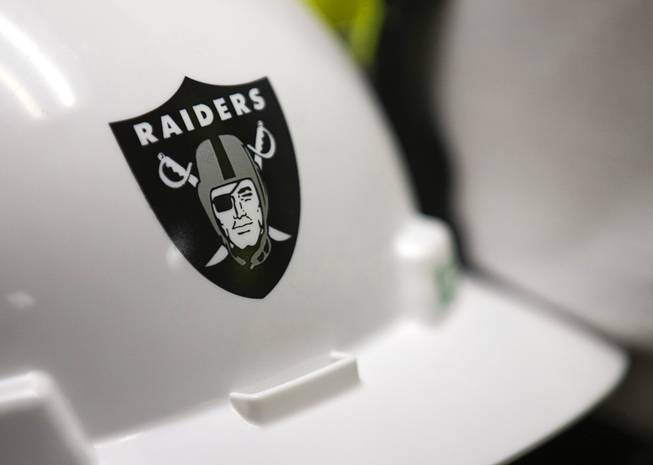 A Raiders logo is shown on a hardhat at the ...