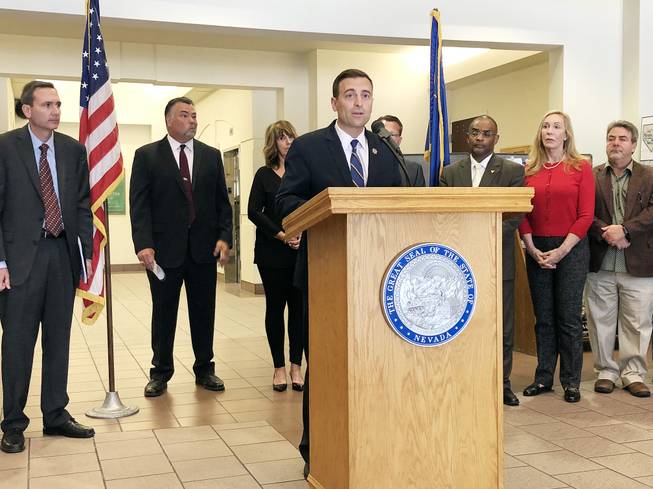 Nevada Attorney General Adam Laxalt announces a lawsuit against Purdue Pharma during a news conference at the Grant Sawyer Building in Las Vegas on May 15, 2018. Laxalt’s office is accusing the drug manufacturer of contributing to the state’s opioid crisis by exaggerating OxyContin’s role in pain relief and purposely understating risk of addiction/