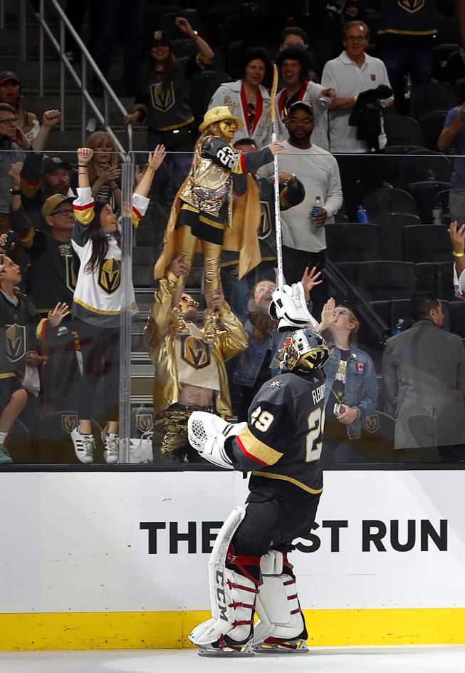 Golden Knights goaltender Marc-Andre Fleury (29) tosses his stick to fans after the Golden Knights 4-2 victory over the Winnipeg Jets in Game 3 of an NHL Western Conference Finals at T-Mobile Arena, Wednesday, May 16, 2018. 