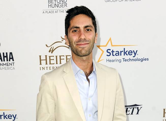 In this Aug. 22, 2014 file photo, Nev Schulman, executive producer of the MTV series "Catfish: The TV Show," arrives at the 3rd Annual Beyond Hunger "A Place At The Table" gala in Beverly Hills, Calif. MTV has temporarily suspended shooting the show while it investigates sexual misconduct accusations made by a woman who appeared on air three years ago. Schulman denied the allegations in a statement Thursday, May 17, 2018. 