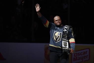 Carnell Johnson waves after performing the Canadian and American national anthems before Game 4 of the NHL hockey playoffs Western Conference finals at T-Mobile Arena Friday, May 18, 2018.