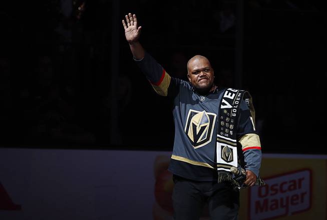 Carnell Johnson waves after performing the Canadian and American national anthems before Game 4 of the NHL hockey playoffs Western Conference finals at T-Mobile Arena Friday, May 18, 2018.