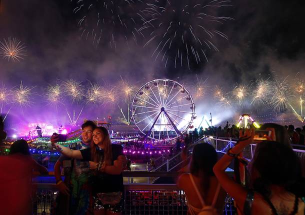 A couple takes a selfie as fireworks explode behind them during the Electric Daisy Carnival at the Las Vegas Motor Speedway early Sunday morning, May 20, 2018.