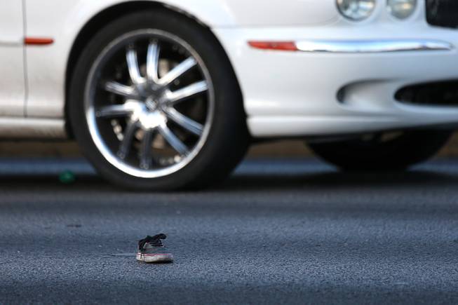A child's shoe is shown in the roadway after an auto-pedestrian accident on southbound Maryland Parkway in front of the Boulevard mall Tuesday, May 22, 2018.