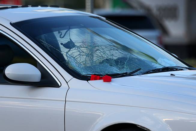 Damage is shown on a Jaguar sedan after an auto-pedestrian accident on southbound Maryland Parkway in front of the Boulevard mall Tuesday, May 22, 2018.