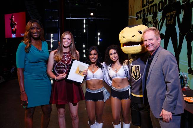 From left, Player Programs & Franchise Development Manager from the Aces Rushia Brown, Coronado High School softball player Tatum Spangler, Raider's cheerleaders, Golden Knights mascot Chance and John Barr from Findlay Toyota pose for a photo after Tatum Spangler wins the Female Athlete of the Year award during the Las Vegas Sun Standout Awards at South Point, Wednesday, May 23, 2018.