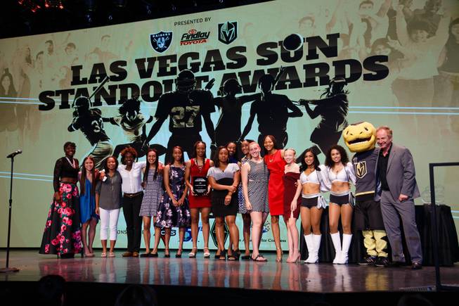 Centennial High School girls basketball players pose for a photo with Raider's cheerleaders, Golden Knights mascot Chance and John Barr of Findlay Toyota after winning the Game of the Year award during the Las Vegas Sun Standout Awards at South Point, Wednesday, May 23, 2018.