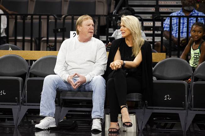 Raiders owner Mark Davis and a guest sit courtside during the Las Vegas Aces season home opener WNBA game against the Seattle Storm at the Mandalay Bay Event Center, Sunday, May 27, 2018. The Aces lost to the Seattle Storm 105-98.