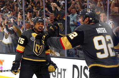 Vegas Golden Knights right wing Ryan Reaves (75) celebrates with left wing Tomas Nosek (92) after Nosek scored in the third period during Game 1 of the NHL Stanley Cup Finals at T-Mobile Arena Monday, May 28, 2018.