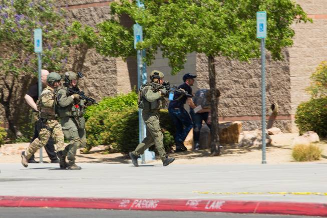 Local law enforcement and first responders participate in an active shooter training scenario at Shadow Ridge High School, Wednesday, May 30, 2018.