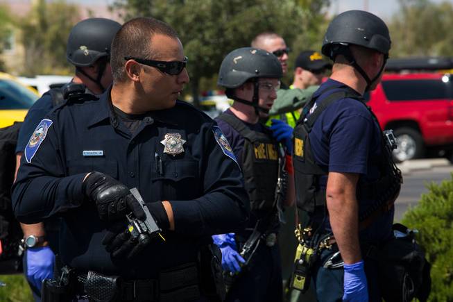 Local law enforcement and first responders particpate in an active shooter training scenario at Shadow Ridge High School, Wed. May 30, 2018.