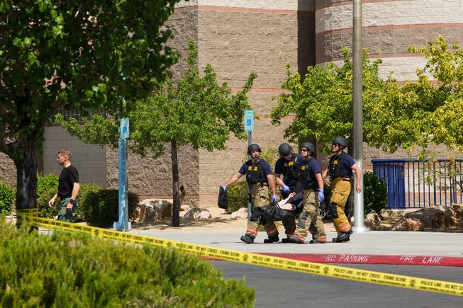 Local law enforcement and first responders particpate in an active shooter training scenario at Shadow Ridge High School, Wed. May 30, 2018.