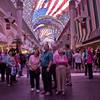 In this March 22, 2012, photo, tourists watch the canopy light show at the Fremont Street Experience in Las Vegas.