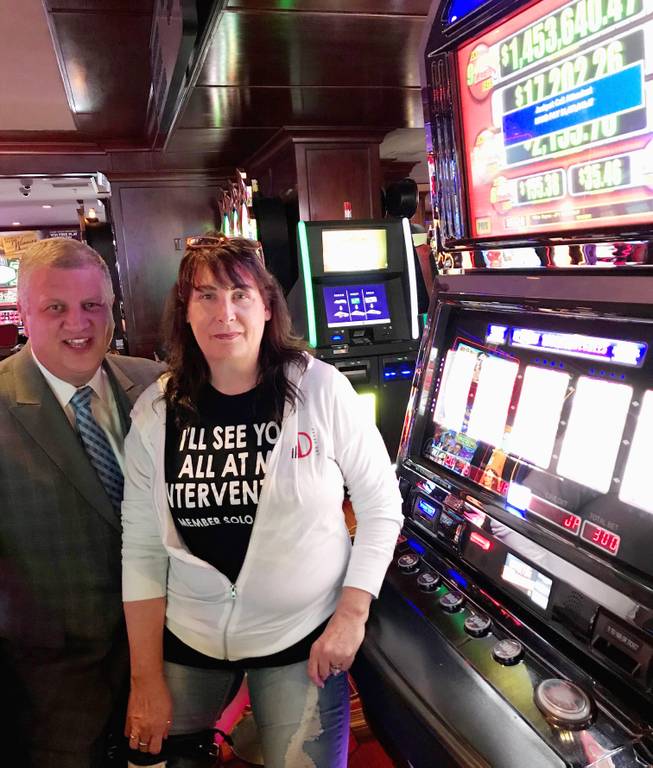Derek Stevens, chief executive officer and owner of the Golden Gate, poses for a photo with a Wisconsin woman who hit a $1.4 million slot machine jackpot at the downtown casino on Tuesday, June 5, 2018.