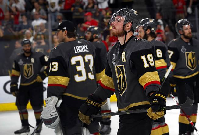 Vegas Golden Knights right wing Reilly Smith (19) watches Washington Capitals players celebrate after beating the Golden Knights 4-3 in Game 5 of the NHL Stanley Cup Final at T-Mobile Arena Thursday, June 7, 2018.