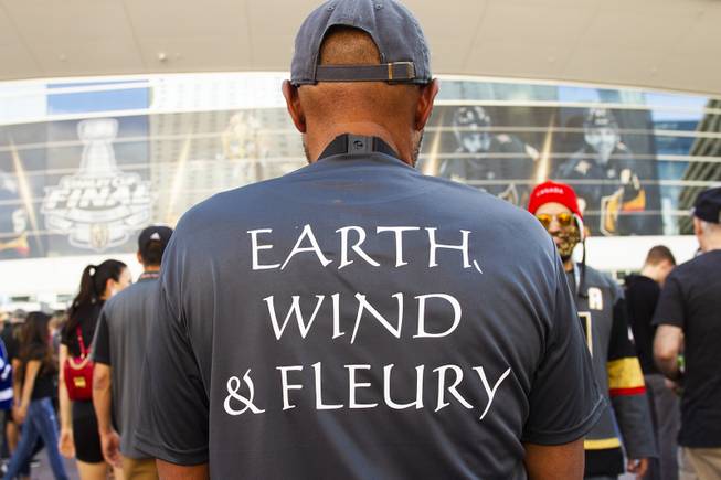 A Golden Knights fan wears an Earth, Wind & Fleury polo during pregame festivities for Game 5 of the NHL Stanley Cup Final with the Vegas Golden Knights against the Washington Capitals at Toshiba Plaza outside T-Mobile Arena, Thursday, June 7, 2018.