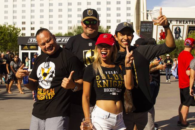 Golden Knights fans pose for a photo during pregame festivities for Game 5 of the NHL Stanley Cup Final with the Vegas Golden Knights against the Washington Capitals at Toshiba Plaza outside T-Mobile Arena, Thursday, June 7, 2018.