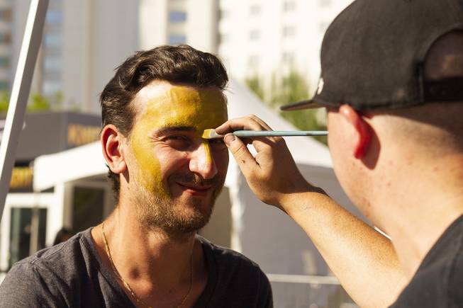 Golden Knights fan Wayne Litherland gets his face painted during pregame festivities for Game 5 of the NHL Stanley Cup Final with the Vegas Golden Knights against the Washington Capitals at Toshiba Plaza outside T-Mobile Arena, Thursday, June 7, 2018.