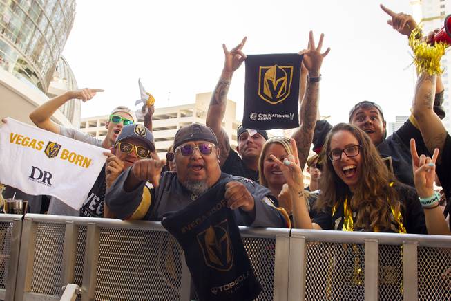 Fans pose for a photo during pregame festivities for Game 5 of the NHL Stanley Cup Final with the Vegas Golden Knights against the Washington Capitals at Toshiba Plaza outside T-Mobile Arena, Thursday, June 7, 2018.
