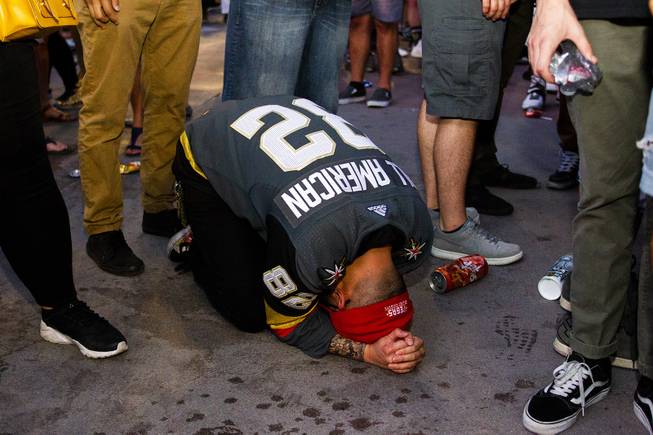 A Golden Knights fan reacts following the Washington Capitals Game 5 NHL Stanley Cup Final 4-3 win against the Vegas Golden Knights at Toshiba Plaza outside T-Mobile Arena, Thursday, June 7, 2018.