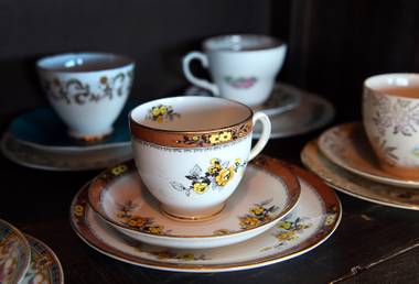 Tea cups and saucers are shown on a shelf in the Twisted Tea Room at The Stove - Kitchen Social, 11261 S. Eastern Ave., in Henderson Saturday, June 2, 2018. The new restaurant and tea shop will open on July 2.