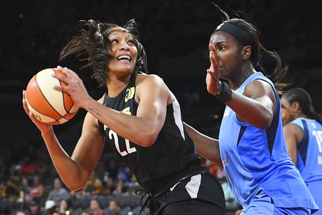 Las Vegas Aces center A'ja Wilson (22) is defended by Atlanta Dream center Elizabeth Williams (1) during their WNBA game Friday, June 8, 2018, at the Mandalay Bay Events Center.