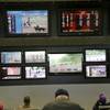 In this May 14, 2018, file photo, patrons watch horse racing on an array of screens at Monmouth Park Racetrack in Oceanport, N.J. New Jersey’s proposed sports betting law is heading down to the wire, with final legislative approval expected on Thursday, June 7. 
