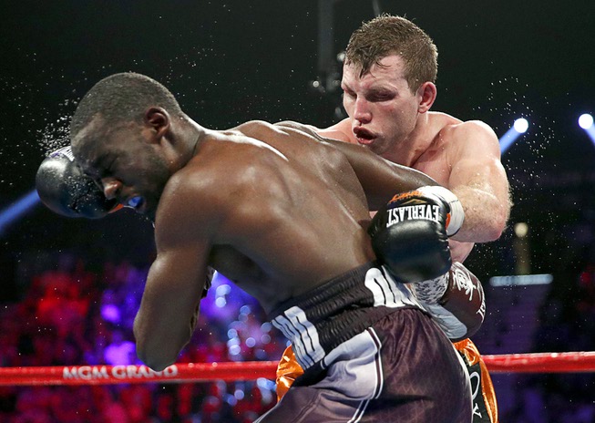 Jeff Horn, of Australia, fights Terence Crawford, left, in a ...
