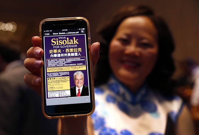 Jiamei Wang shows a Chinese-language website supporting Democratic gubernatorial candidate ...