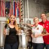 Brandy Strauser Sobanski and her parents Nicholas and Connie Strauser pose for a photo in their family owned distillery, N Scott Distillery, located in Las Vegas, May 18, 2018.
