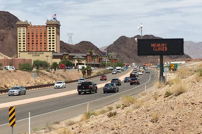 Authorities closed U.S. 93 in both directions after reports of a man armed with a gun and in a heavily reinforced vehicle near the Hoover Dam on Friday, June 15, 2018.